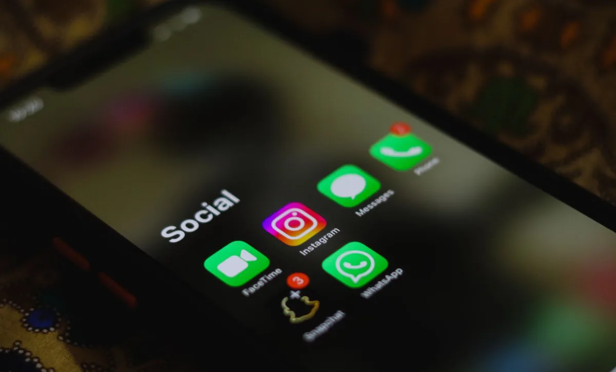 Smartphone displaying social media app icons