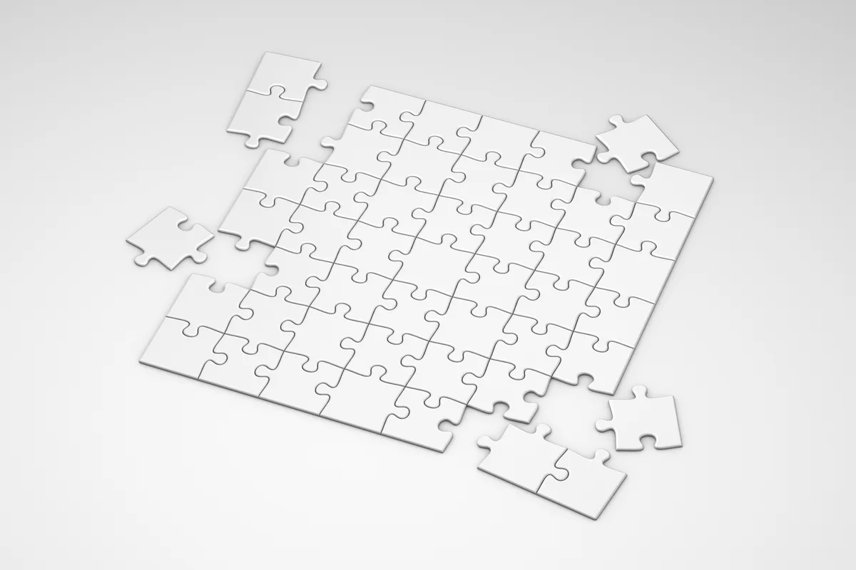 Incomplete white puzzle pieces, minimalist top view