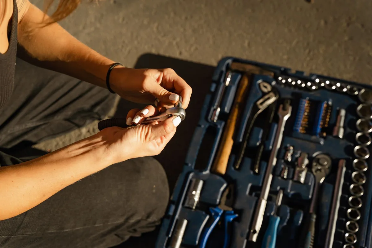 Close-up of hands using tools in a workshop
